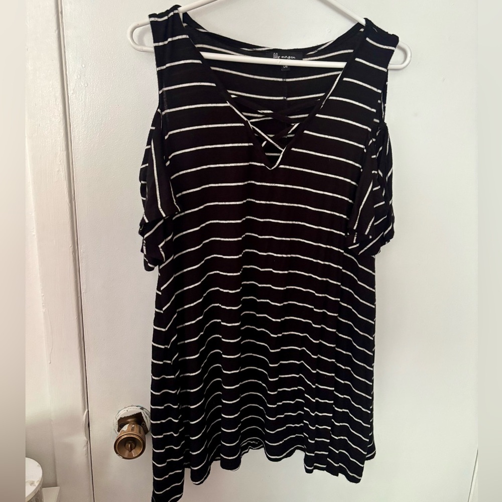 Flowy and flattering striped tunic top lace up with shoulder cut out accents